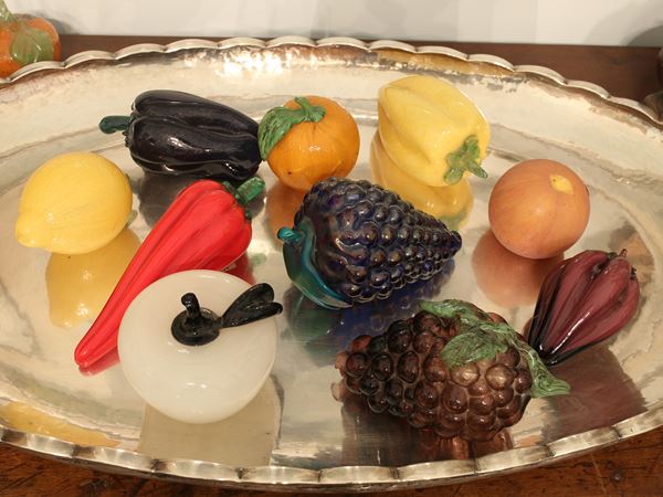 A lot of nine blown glass fruits and vegetables