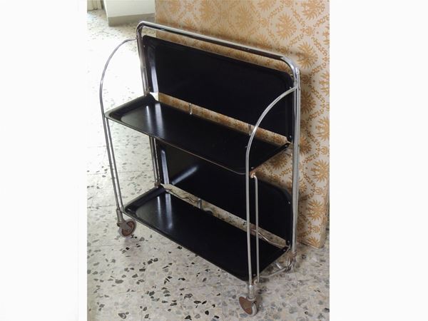 A Gerinol folding service trolley in cromed metal and black laminated wood