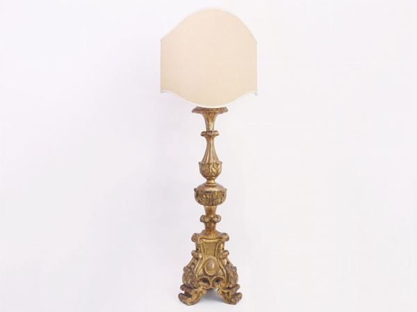 A gilted and curved candelabra