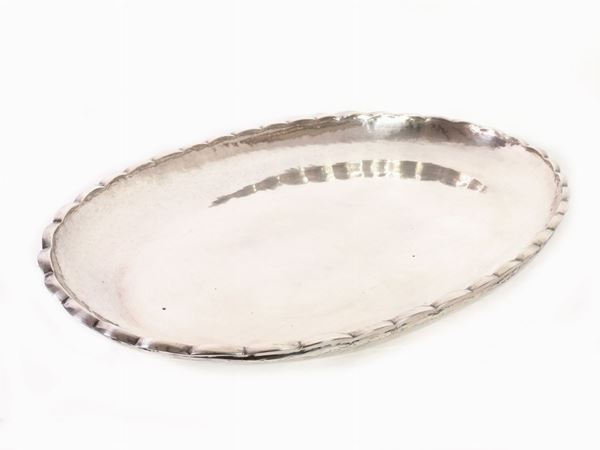 A large sterling silver centerpiece tray