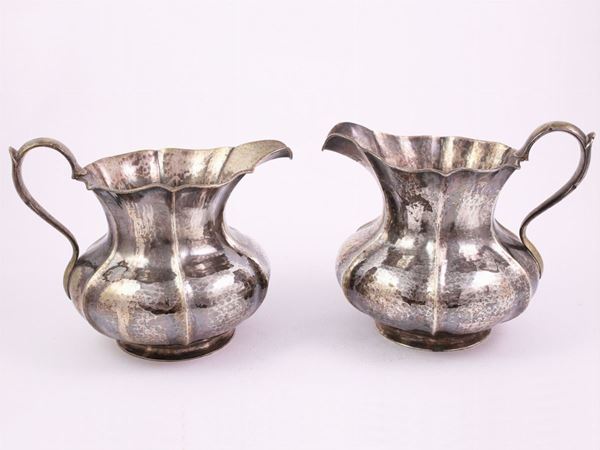 A pair of silver jugs