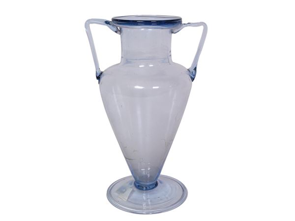 A blown light blue vase with handles