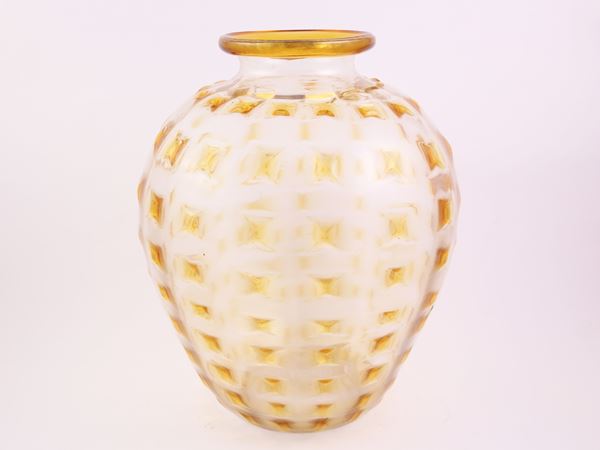 A yellow blown glass vase with an applied yellow glass rim