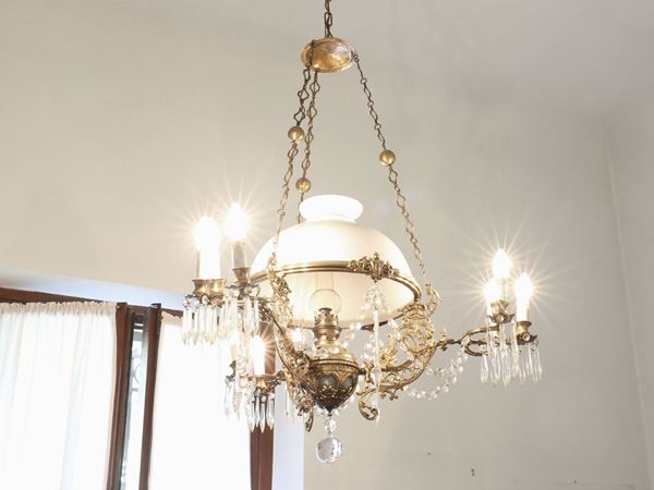 A gilted metal oil chandelier