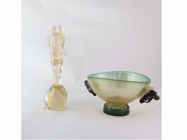 Lovers glass group with gold inclusions and a glass vase bowl with two black women heads applied