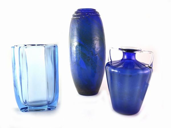 Three different blue glass vases