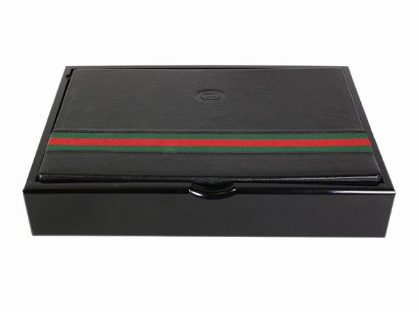 A Gucci black laquered game box