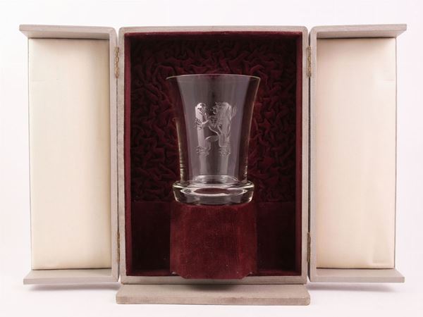 A crystal glass with an engraved rampant lion