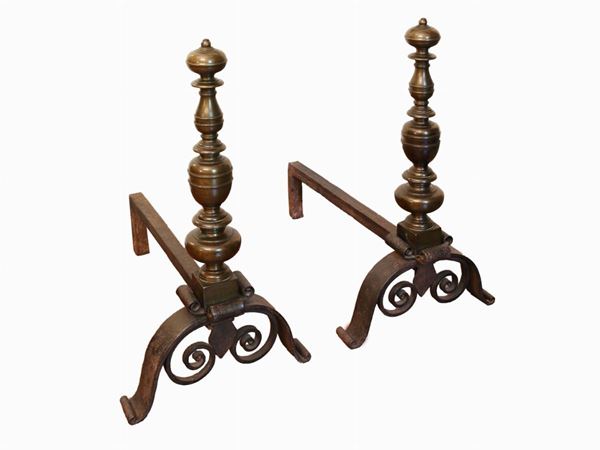 A pair of bronze and wrought iron andirons