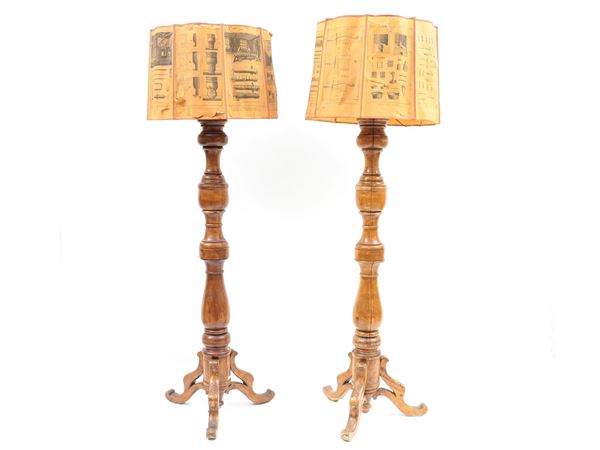 A pair of large walnut candleholders