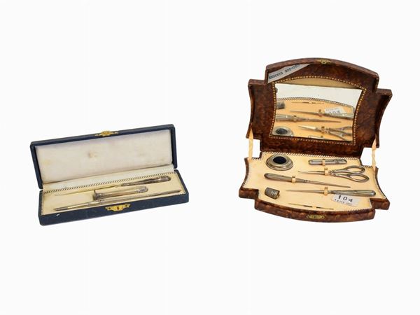 A silver sewing and silver writing set
