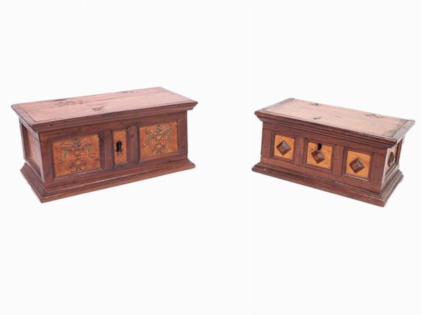 Two walnut and other woods caskets