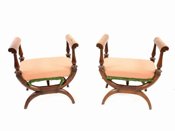 A pair of walnut faldistorio stools