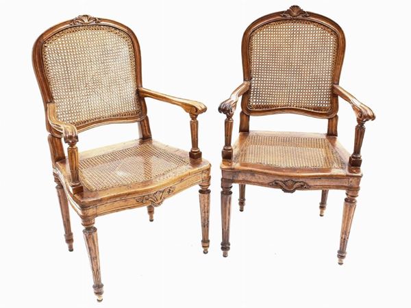 A set of nine small cherrywood armchairs