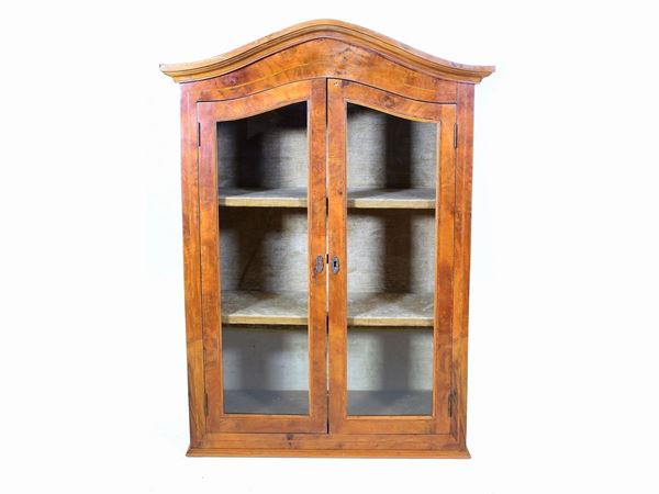 A small cherrywood veneered hanging cabinet