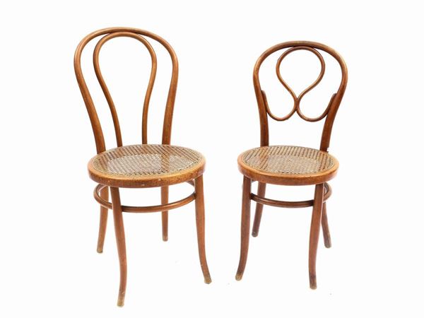 Two curved beech chairs