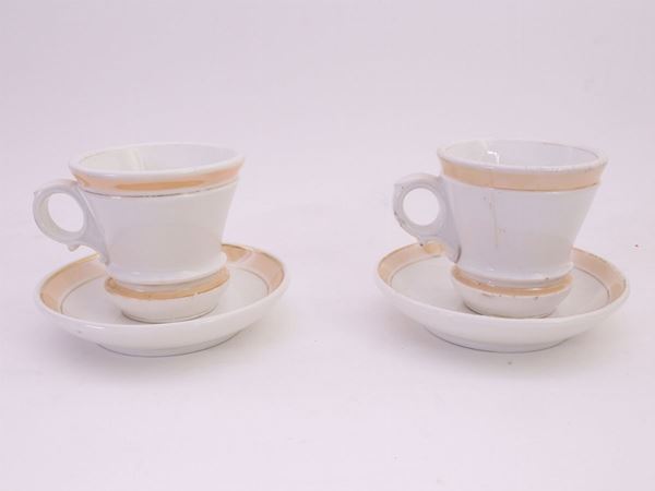 Serie di dodici tazze da caffellatte in porcellana Ginori