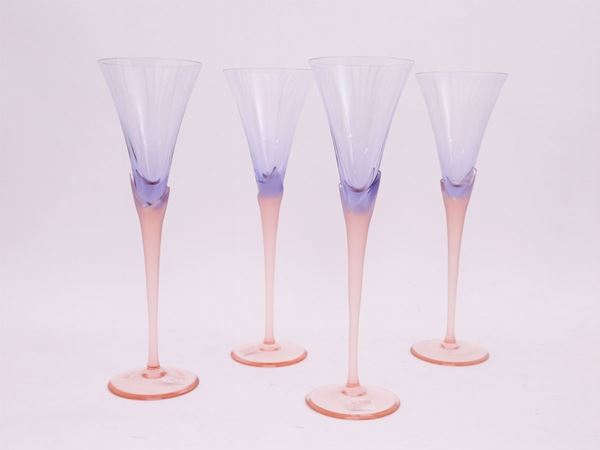 A set of welve violet and pink crystal flutes