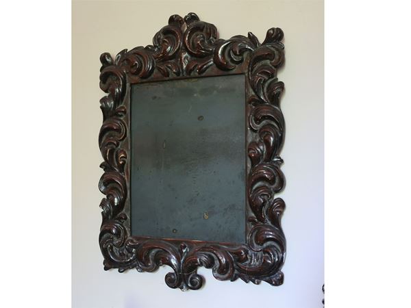 A softwood curved frame with mirror