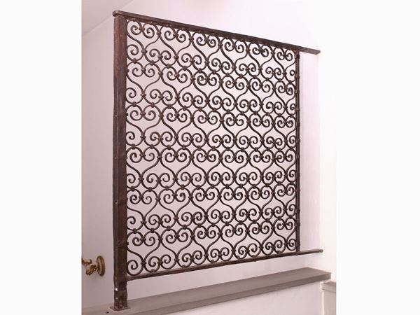 A wrought iron grate
