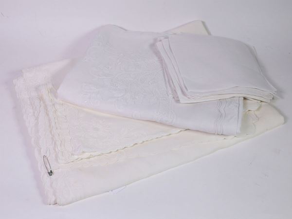 Two white embroidered linen tablecloths