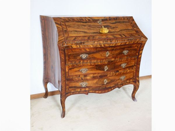 A olive and walnut veneered folding desk