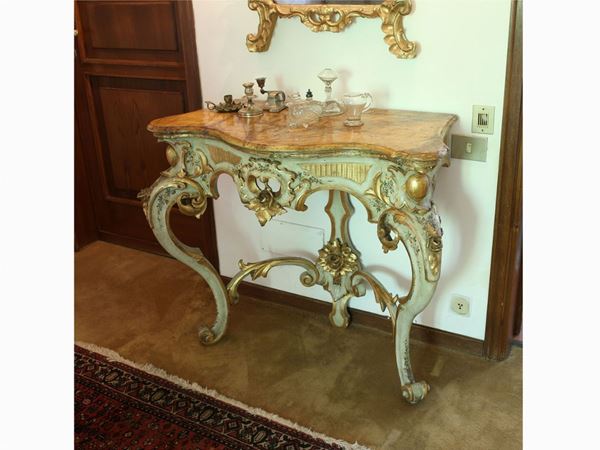 A giltwood and green laquered console