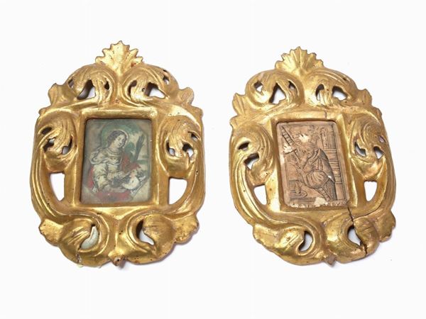 A pair of small giltwood and carved frames