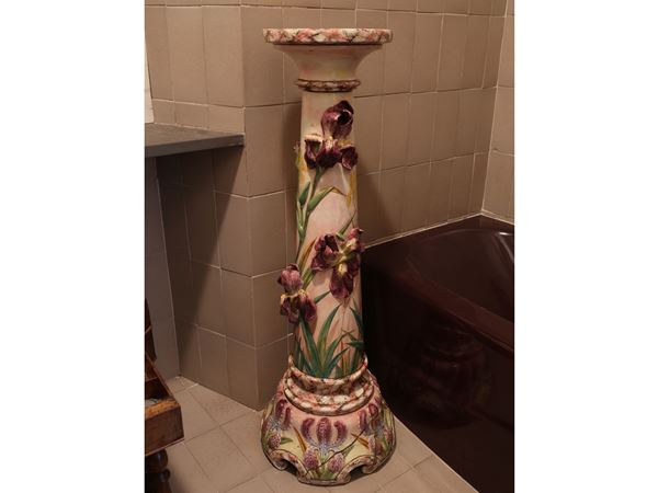 An Art nouveau ceramic flowerpot stand