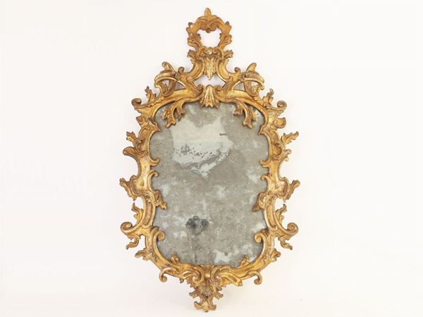 A giltwood and curve mirror