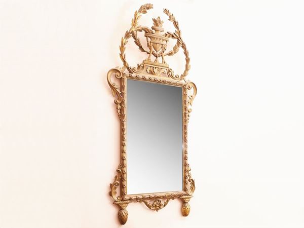 A giltwood and curved mirror