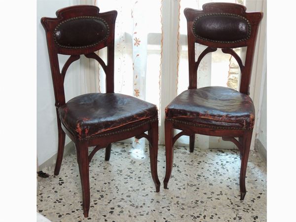 A pair of mahogany liberty chair