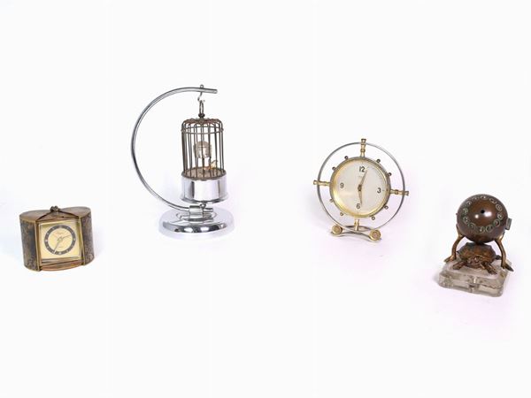 Four decorative metal table clocks