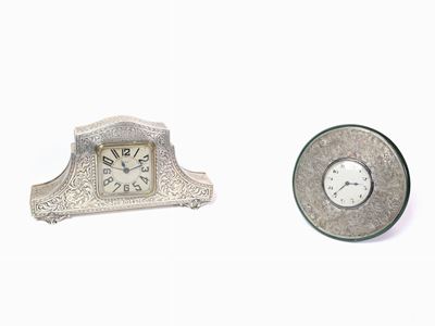 Due Sveglie Rivestite in Argento