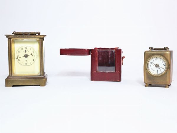 Two brass official clocks