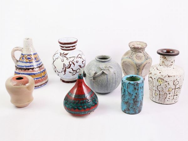 Eight ceramic small vases