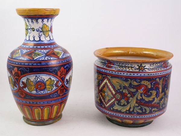 A luster ceramic vase and potholder