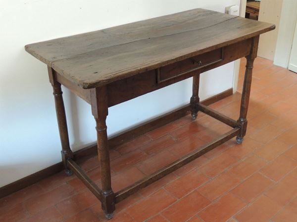 A rustic walnut table