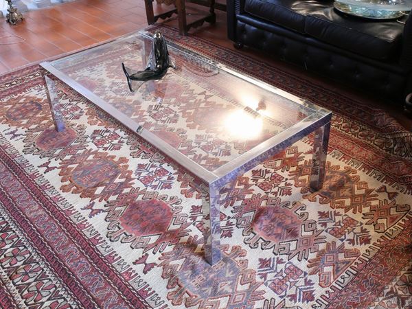 A metal and crystal coffee table