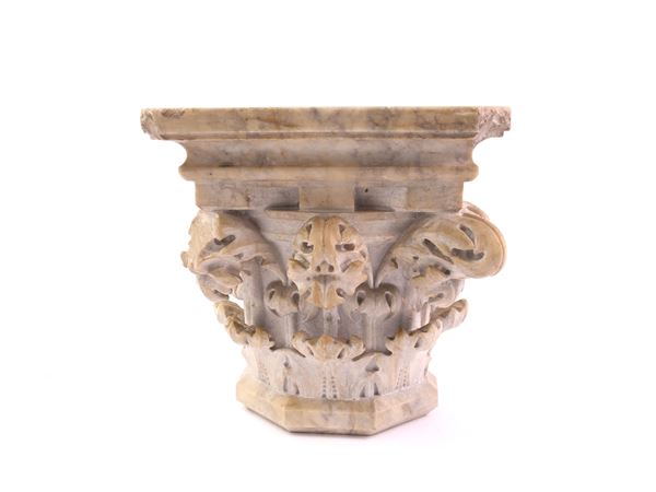 An ancient white marble capital