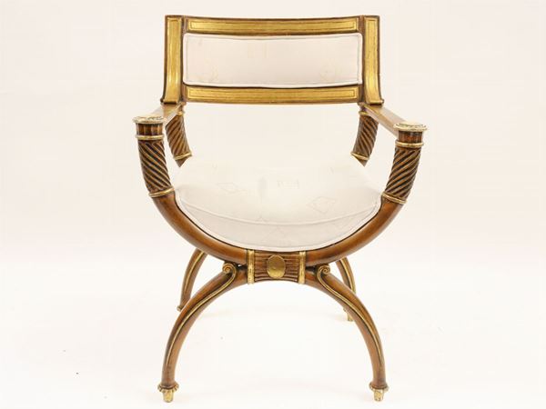 A lacquered and giltwood armchair