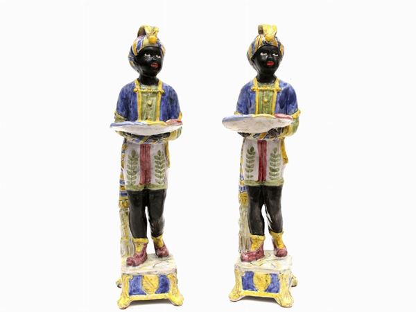A glazed and painted terracotta pair of Mori