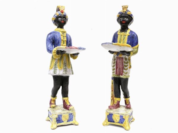 A glazed and painted terracotta pair of Mori