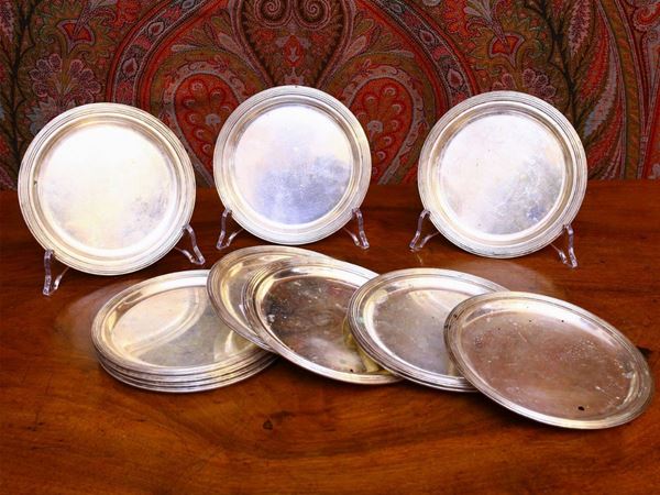 Serie di dodici piattini da pane in argento Teghini
