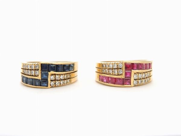 Pair of yellow gold band rings with diamonds, rubies and sapphires