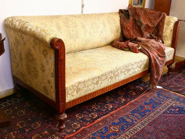 A walnut upholstered sofa