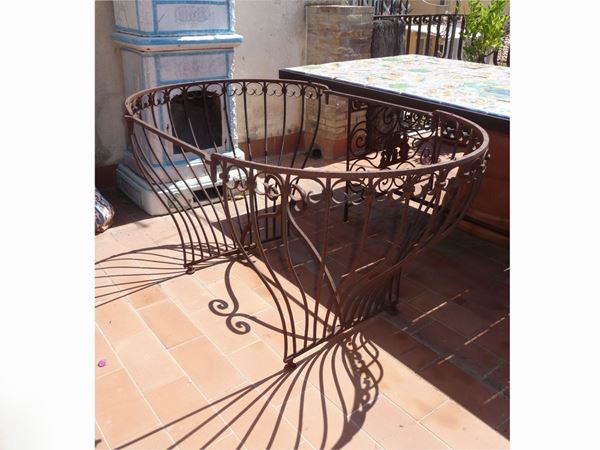 A wrought iron table base