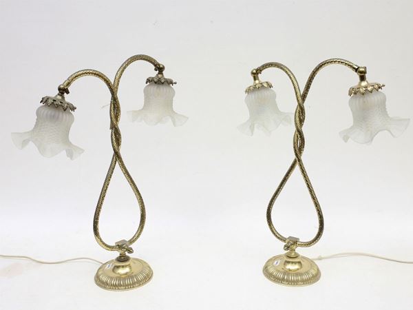A pair of gilded metal lamps