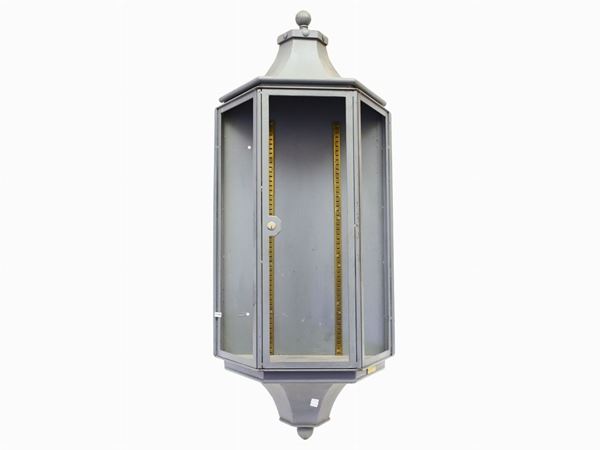 A large grey lacquered metal wall lamp
