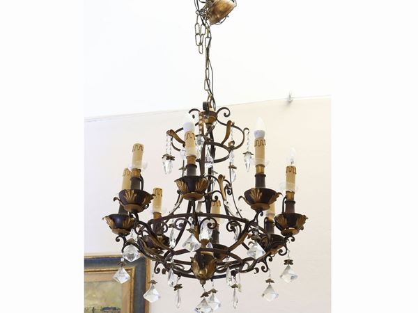 A patined and gilded chandelier  - Auction Antiquities, Interior Decorations and Vintage  from the Panarello Gallery in Taormina - Maison Bibelot - Casa d'Aste Firenze - Milano